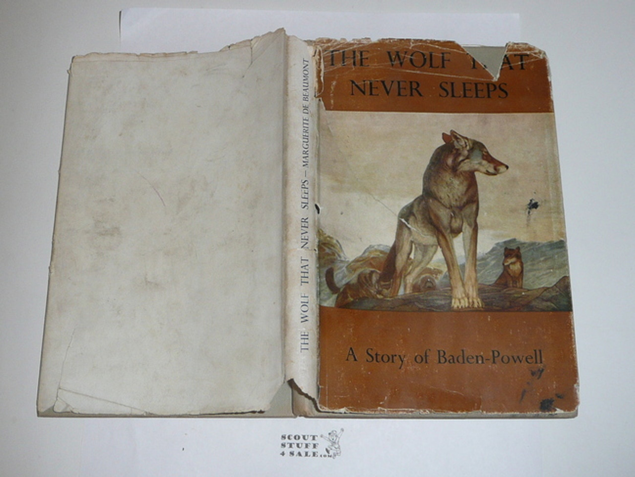 1951 The Wolf that Never Sleeps, by Marguerite De Beaumont, 5th printing, with dust jacket, pencil notes on table of contents page but otherwise unmarked