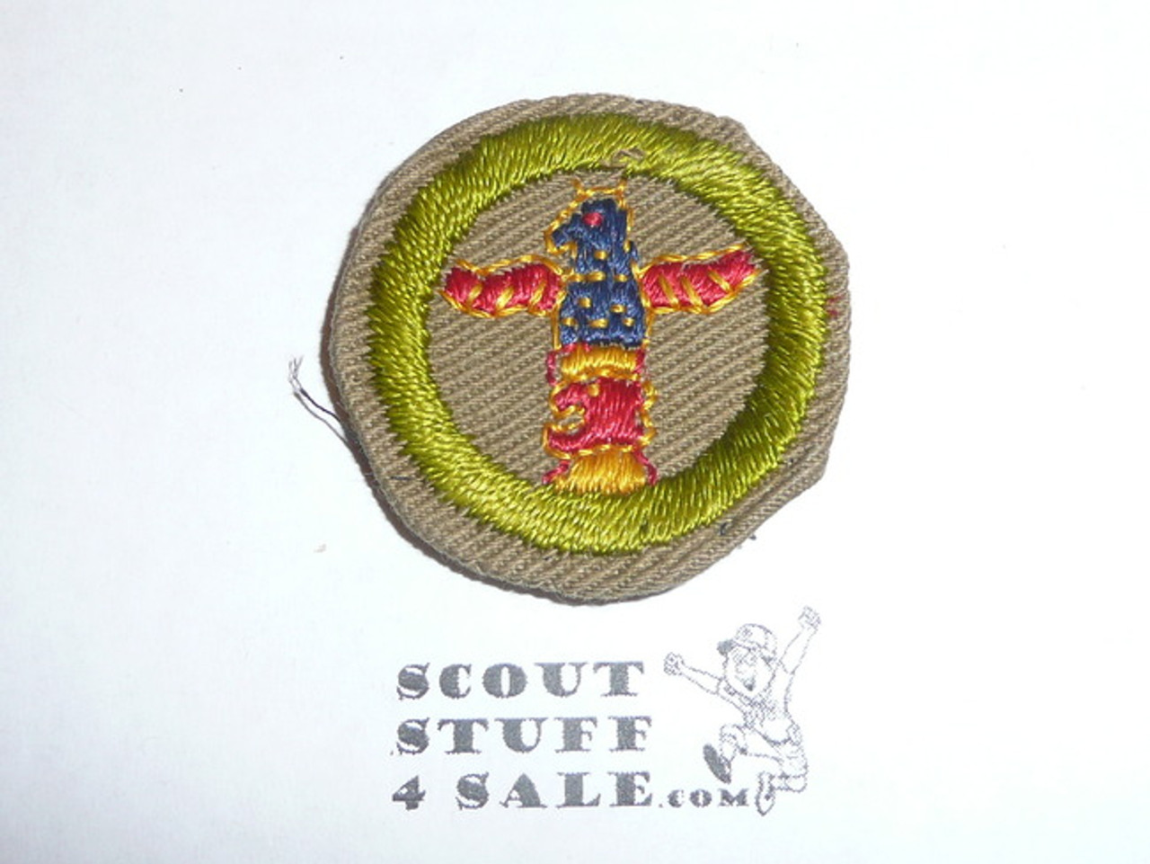 Wood carving - Type C - Tan Crimped Merit Badge (1936-1946), was sewn but in very good condition