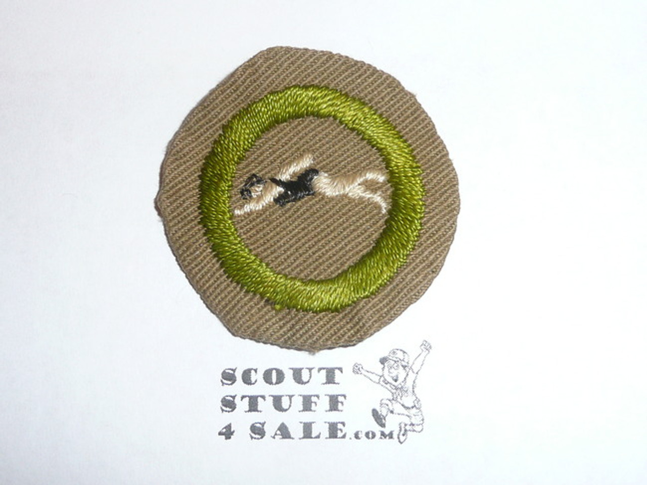 Swimming - Type B - Wide Crimped Bdr Tan Merit Badge (1934-1935), was sewn but in very good condition