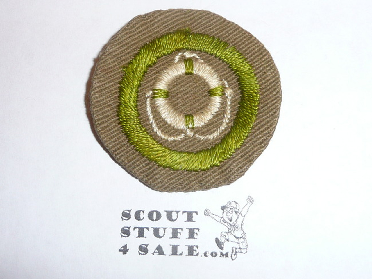 Lifesaving - Type B - Wide Crimped Bdr Tan Merit Badge (1934-1935), was sewn but in very good condition