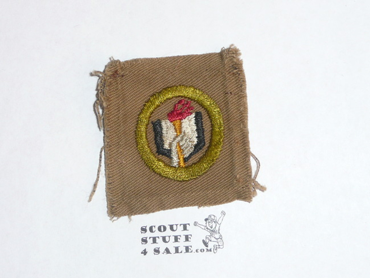 Scholarship - Type A - Square Tan Merit Badge (1911-1933), used, black stripe with scout emblem on back