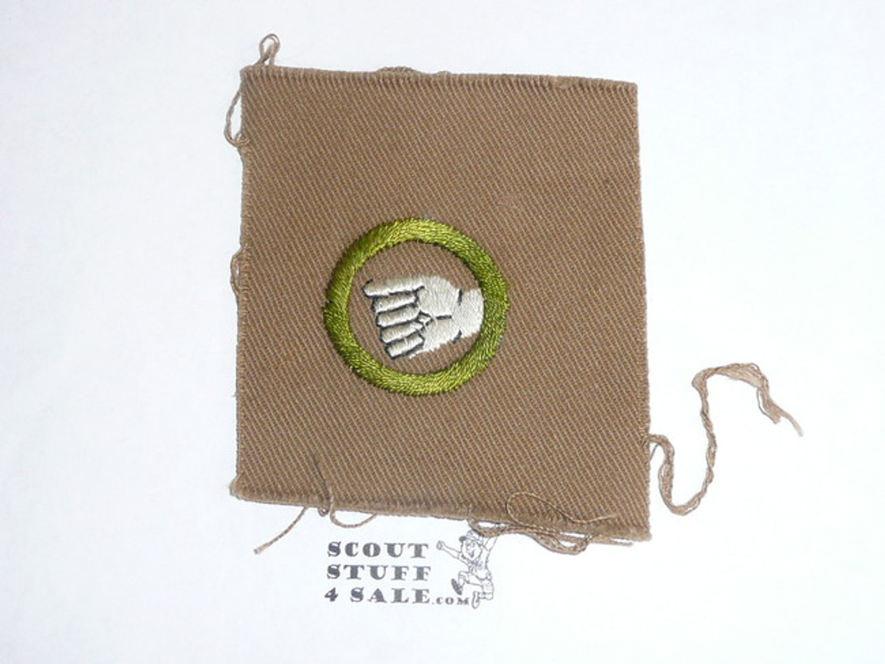Physical Development - Type A - Square Tan Merit Badge (1911-1933), TEENS extended thumb, huge piece of cloth, black striped back
