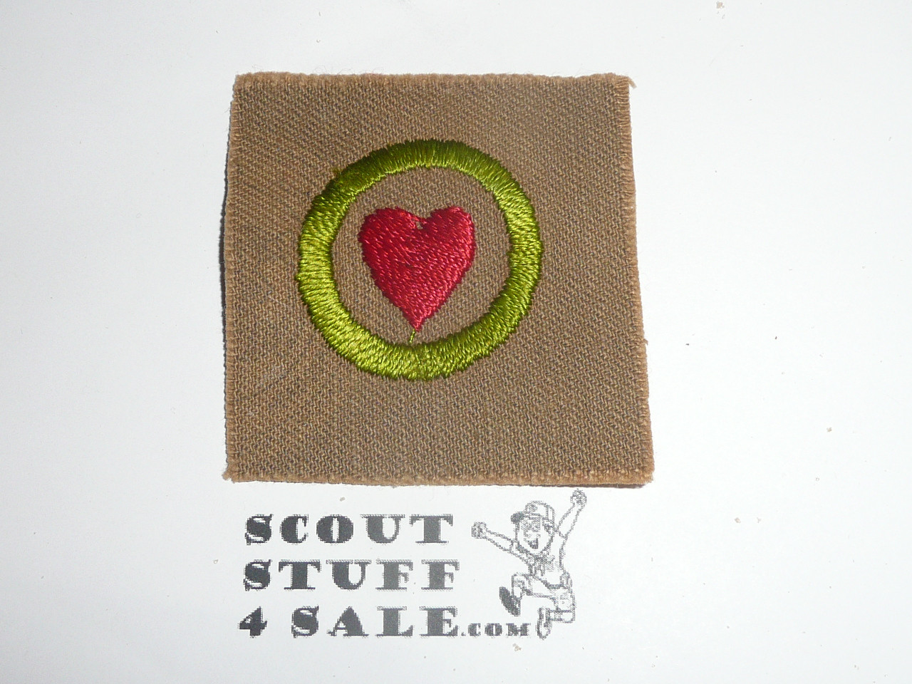Personal Health - Type A - Square Tan Merit Badge (1911-1933), black striped back with emblem