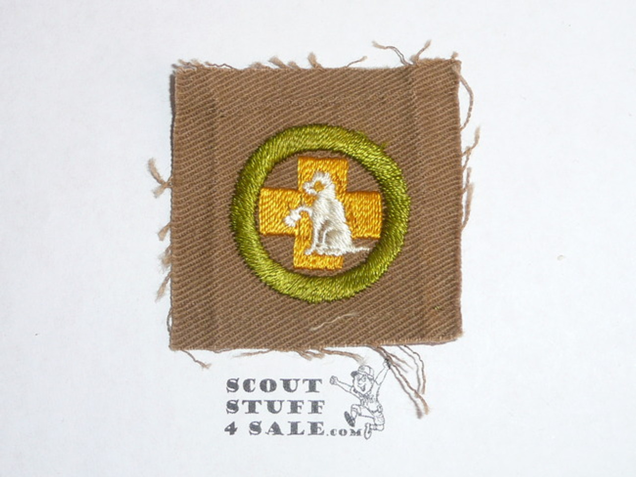 First Aid to Animals - Type A - Square Tan Merit Badge (1911-1933), lt use