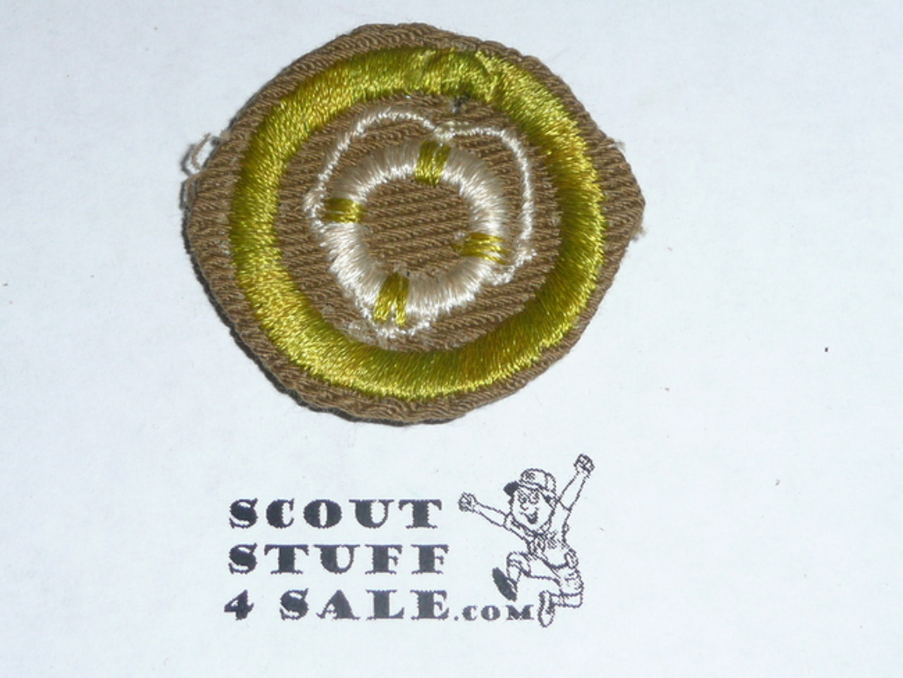 Lifesaving - Type C -  Tan Crimped Merit Badge (1936-1946)