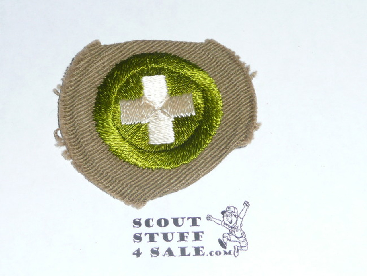 Safety - Type B - Wide Crimped Bdr Tan Merit Badge (1934-1935)