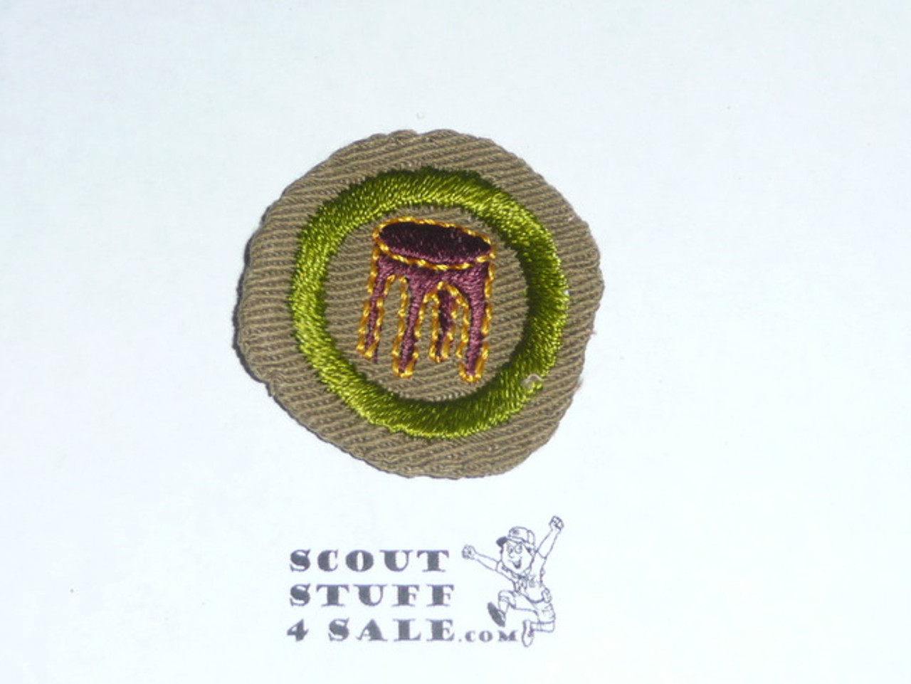 Woodwork - Type B - Wide Crimped Bdr Tan Merit Badge (1934-1935), Used