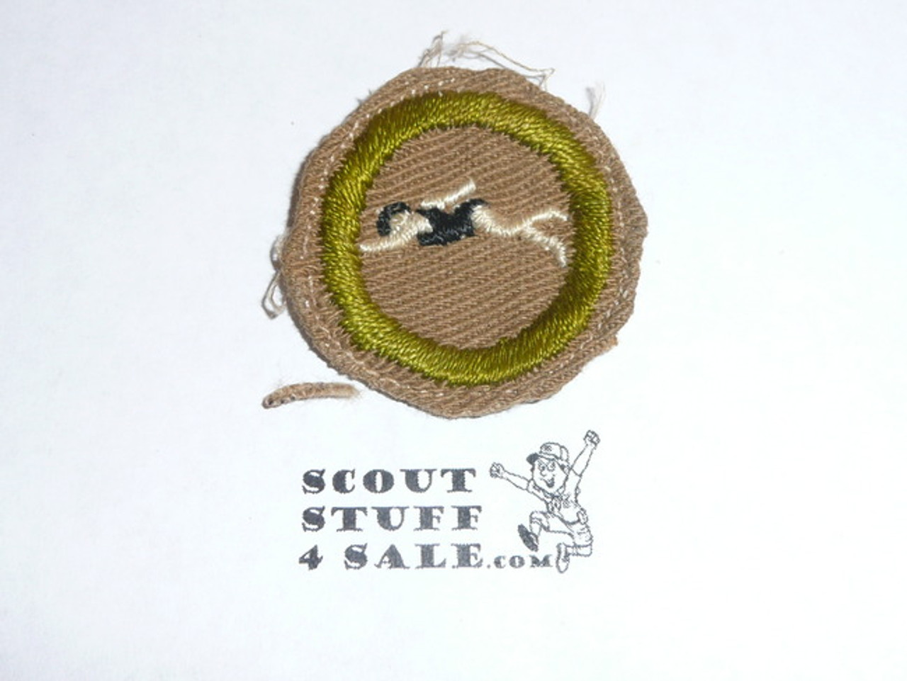 Swimming - Type A - Square Tan Merit Badge (1911-1933), Material folded under with some trimming