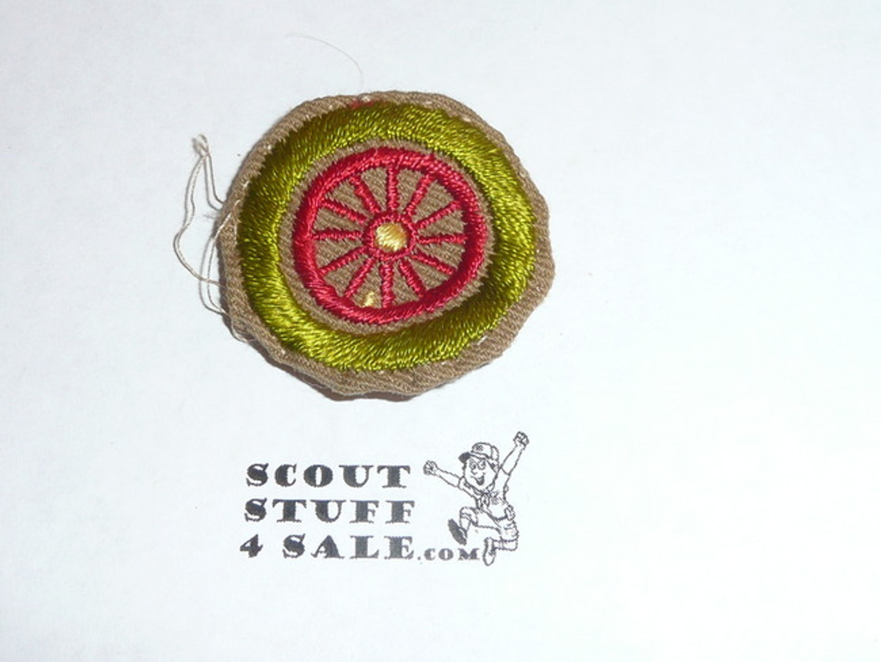 Automobiling - Type A - Square Tan Merit Badge (1911-1933), Material folded under with some trimming