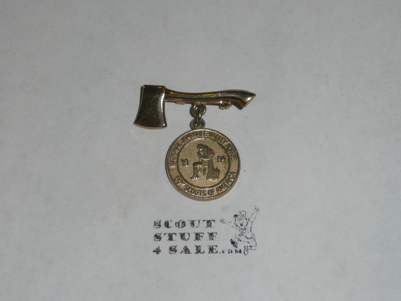 1964 National Jamboree Axe pin with Jamboree emblem suspended from it
