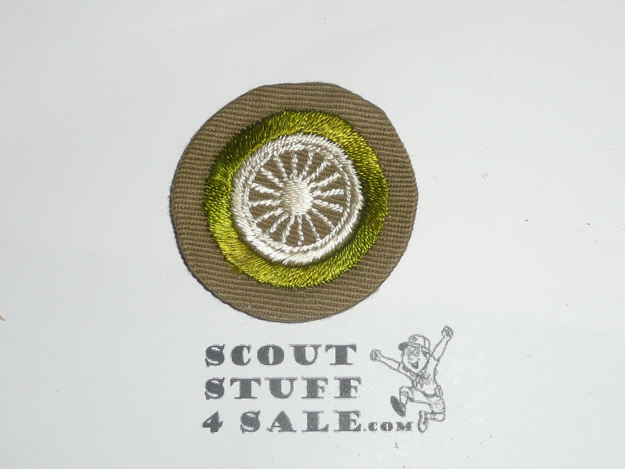 Cycling - Type B - Wide Crimped Bdr Tan Merit Badge (1934-1935)