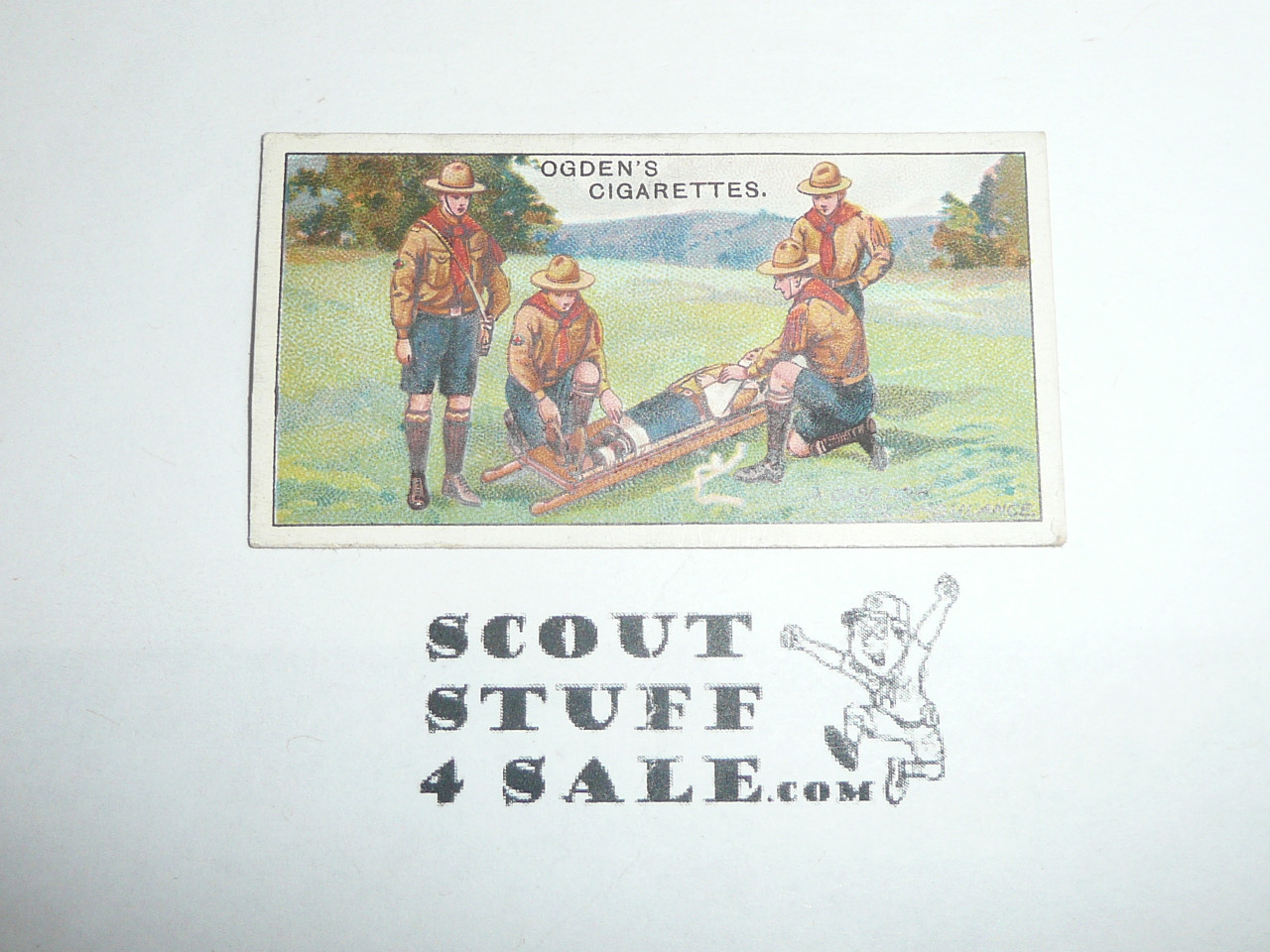 Ogden Tabacco Company Premium Card, First Boy Scout Series of 50 (Blue Backs), Card #40 Transporting a Wounded Comrade, 1911