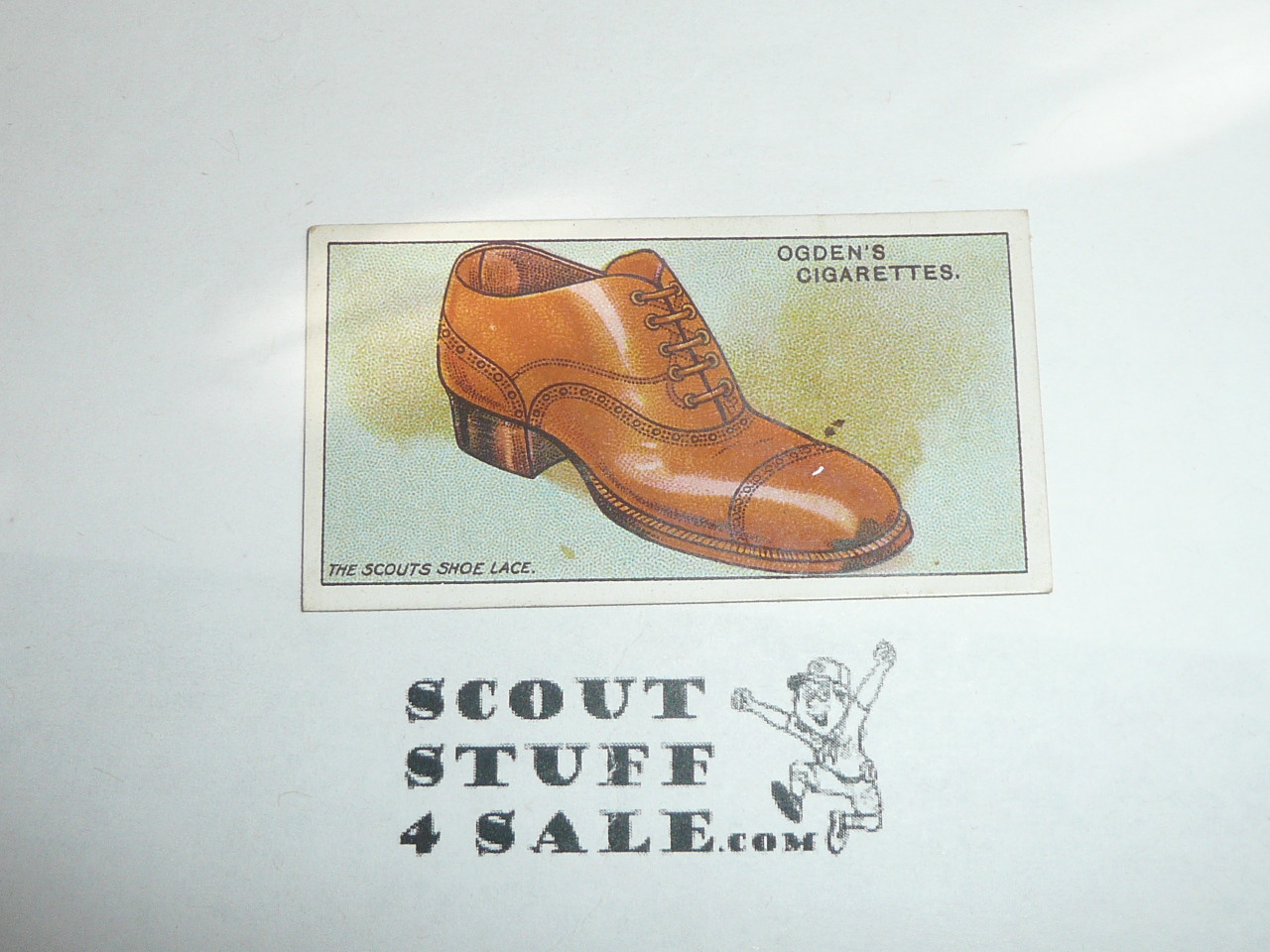 Ogden Tabacco Company Premium Card, Second Boy Scout Series of 50 (Blue Backs), Card #95 How to Tie a Shoe Lace, 1912