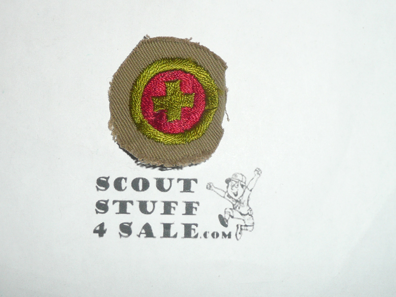 First AId - Type A - Square Tan Merit Badge (1911-1933), Material trimmed