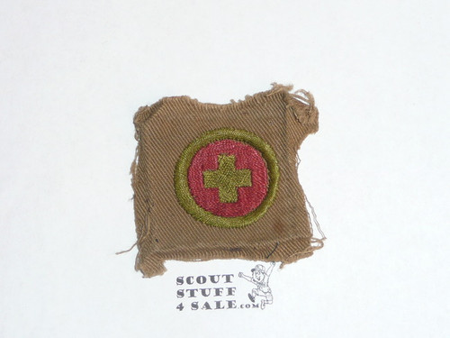 First Aid - Type A - Square Tan Merit Badge (1911-1933), used, brown stripe and emblem on back