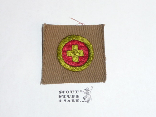 First Aid - Type A - Square Tan Merit Badge (1911-1933), black stripe back