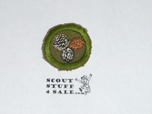 Nut Culture - Type A - Square Tan Merit Badge (1911-1933), cut to round or little material
