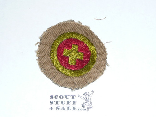 First AId - Type A - Square Tan Merit Badge (1911-1933), Material trimmed and badge used