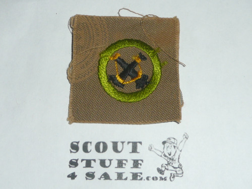 Firemanship - Type A - Square Tan Merit Badge (1911-1933), lt stain at upper left, emblem on back