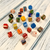 A pile of small, multi-colored round glass beads for DIY bracelet and necklace making.