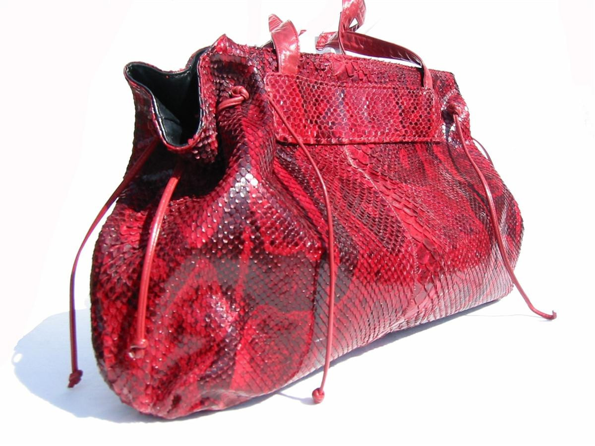 Carlos Falchi backpack great condition Carlos Falchi, 70, Dies; Turned Exotic Animal Skins Into  main image 4