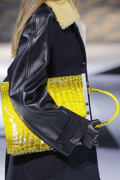 Fall 2018 runway look with a yellow crocodile-skin top-handle bag