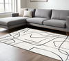 8' X 10' Ivory And Black Abstract Area Rug