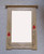 Portrait Mirror with Red Glass Inlays and Studs by Archie McDonald SOLD