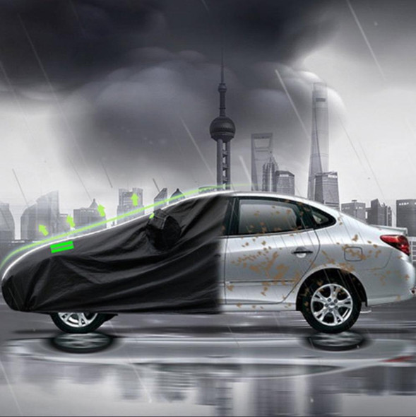 CRAFTEK CAR COVER CRAFTEK GUD-BY-1026XL WATERPROOF BLACK XL FOR CAR 187" TO 193" LONG, black waterproof car cover protecting a silver vehicle during rain with a cityscape background.