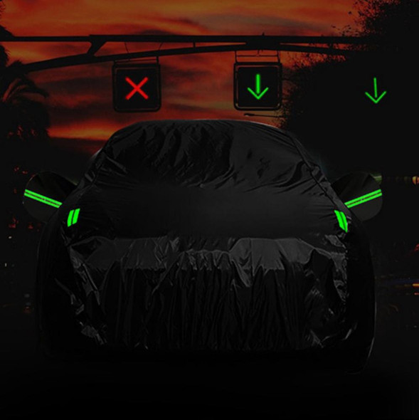 CRAFTEK CAR COVER CRAFTEK GUD-BY-1026S WATERPROOF BLACK SMALL FOR CAR LESS THAN 165 Inches Long, protective waterproof car cover wrapped around a vehicle at dusk with illuminated reflective strips.