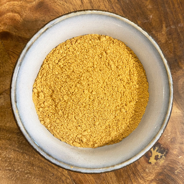 Bael Fruit Powder pictured in a bowl – premium quality exotic herbal tea and cooking ingredient