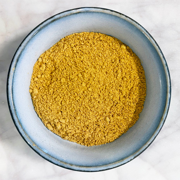 Bael Fruit Powder pictured in a bowl – premium quality exotic herbal tea and cooking ingredient