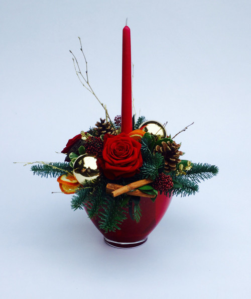 The deluxe classic candle created in a  luxury red  pot, full of festive goodies, foliage and red roses. 