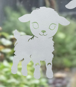 Close-up of a left-facing frosted  Lamb window cling clinging to glass, showing etched-glass texture and soft matte finish.
