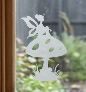 Close-up of a right-facing frosted   Tilly Tuffet - Fairy window cling clinging to glass, showing etched-glass texture and soft matte finish.