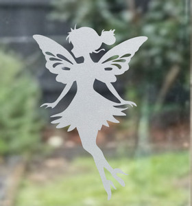 Close-up of a left-facing frosted  Liora - fairy window cling clinging to glass, showing etched-glass texture and soft matte finish.