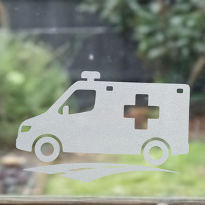 Close-up of a left-facing frosted Ambulance window cling clinging to glass, showing etched-glass texture and soft matte finish.