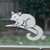 Close-up of a left-facing frosted Brushtail Possum window cling clinging to glass, showing etched-glass texture and soft matte finish.