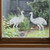 Two frosted Emu window clings displayed on a window, showing left and right-facing designs with etched-glass texture and soft matte finish.