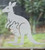 Close-up of a left-facing frosted Kangaroo + Joey window cling clinging to glass, showing etched-glass texture and soft matte finish.