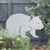 Close-up of a right-facing frosted  Wombat window cling clinging to glass, showing etched-glass texture and soft matte finish.