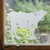 Close-up of a right-facing frosted  Cow window cling clinging to glass, showing etched-glass texture and soft matte finish.