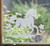 Close-up of a right-facing frosted  Pony window cling clinging to glass, showing etched-glass texture and soft matte finish.