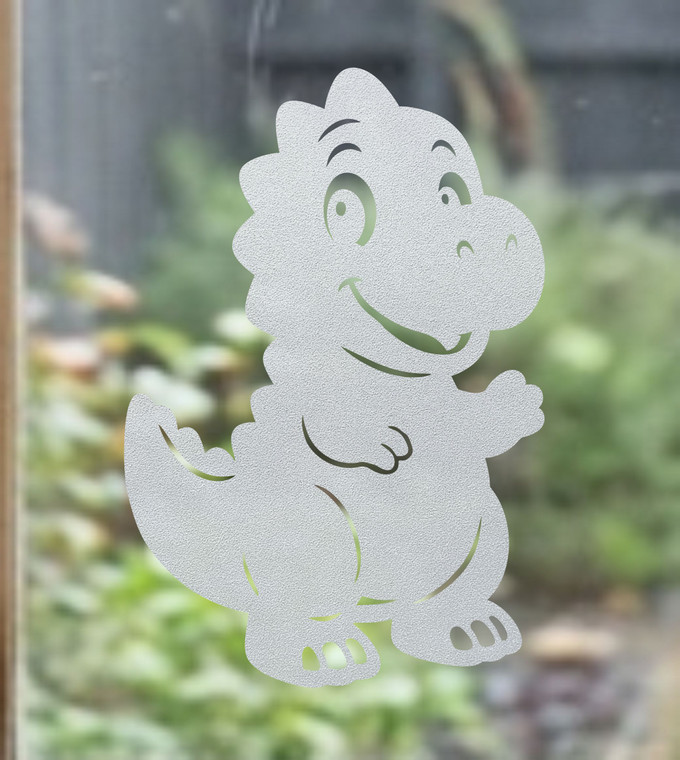 Close-up of a right-facing frosted  T-Rex window cling clinging to glass, showing etched-glass texture and soft matte finish.