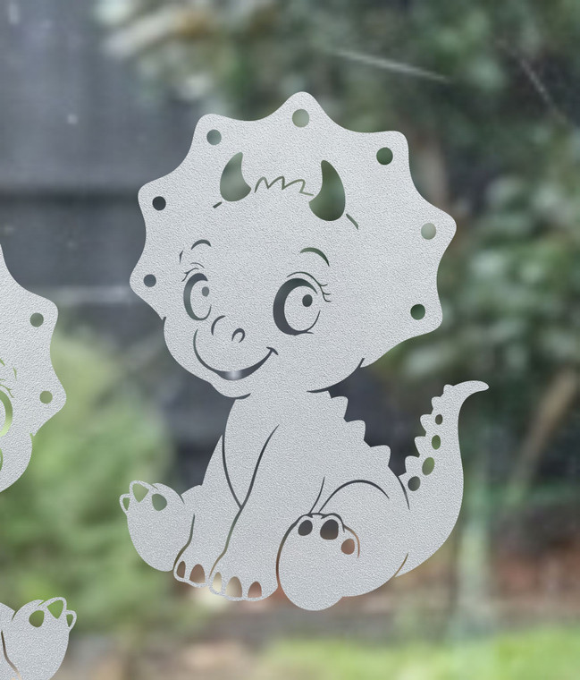 Close-up of a left-facing frosted Triceratops window cling clinging to glass, showing etched-glass texture and soft matte finish.