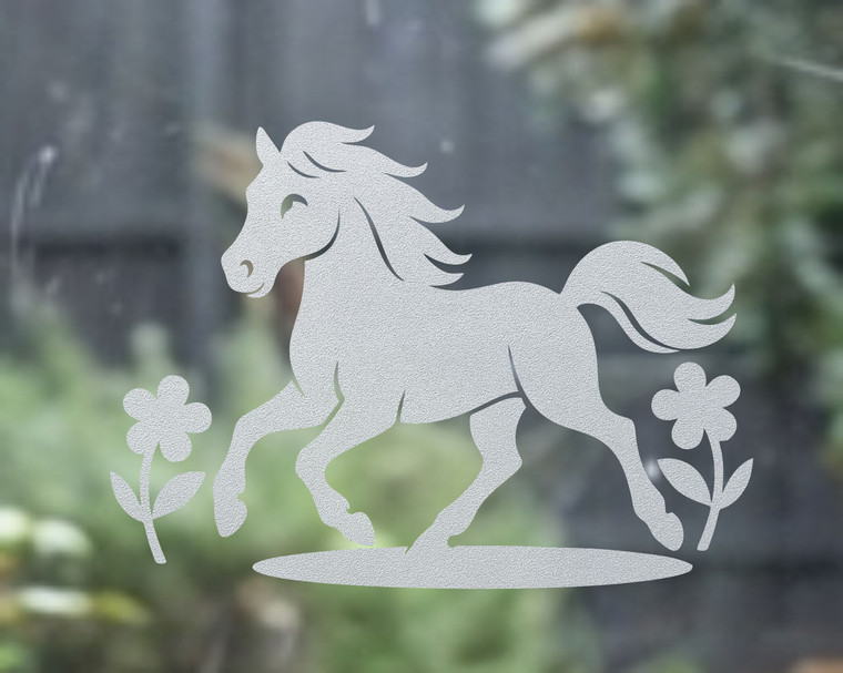 Close-up of a left-facing frosted Pony window cling clinging to glass, showing etched-glass texture and soft matte finish.
