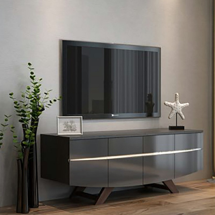large modern TV stand with a curved bottom in dark gray. This TV stand also has lots of storage.