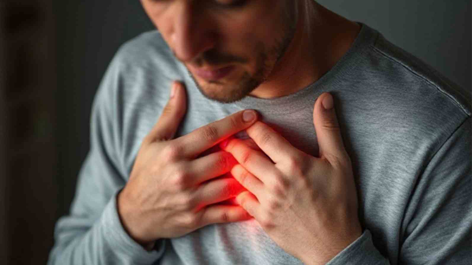 A man with a red glowing in his chest, symbolising heartburn.
