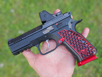 A CZ Shadow 2 Compact equipped with Vytal's stellar Kraken Combo, featuring a set of Black & Red Two Tone Kraken grips, a Ruby Red basepad and mag release button done in matching style.