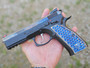 Vytal Manufacturing's signature Blue & Silver Two Tone color anodizing, applied to a set of their iconic Kraken grips and displayed on a CZ handgun.